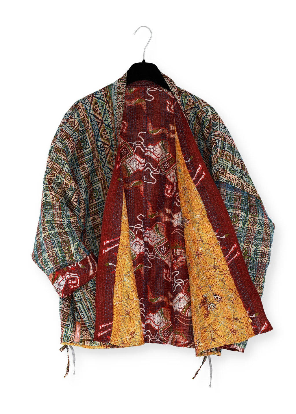 Reversible one of a kind silk jacket from collected vintage fabrics. A beautiful blend of art and craft.
