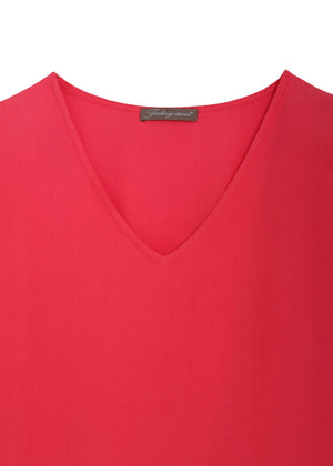 Långärmad klänning med volanger i viskos crepe - coral