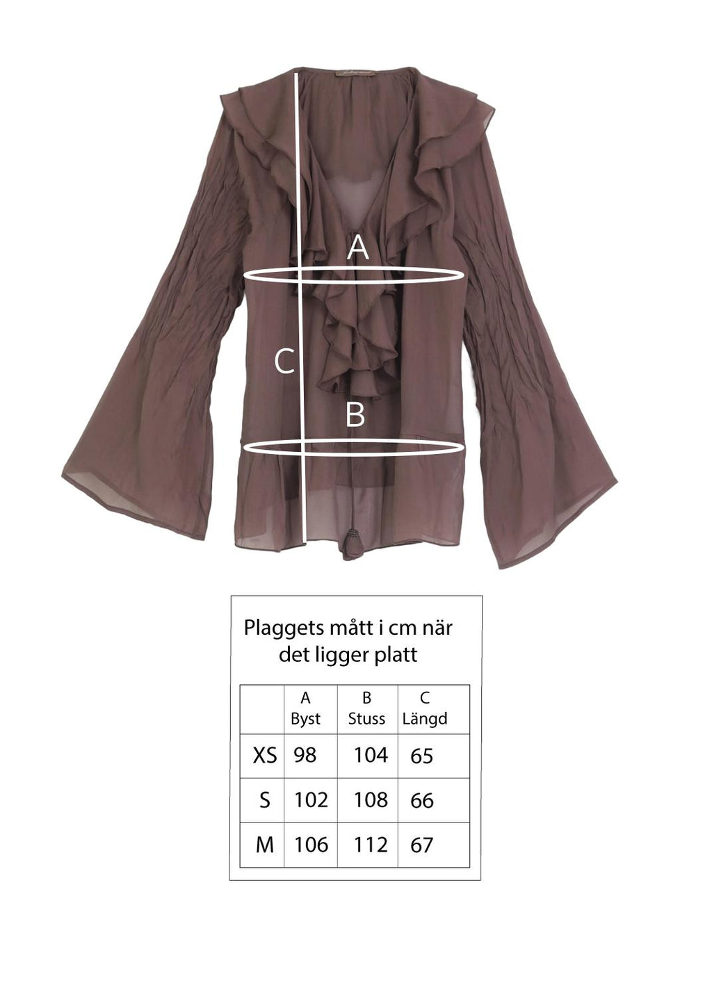 Blus med volanger i siden