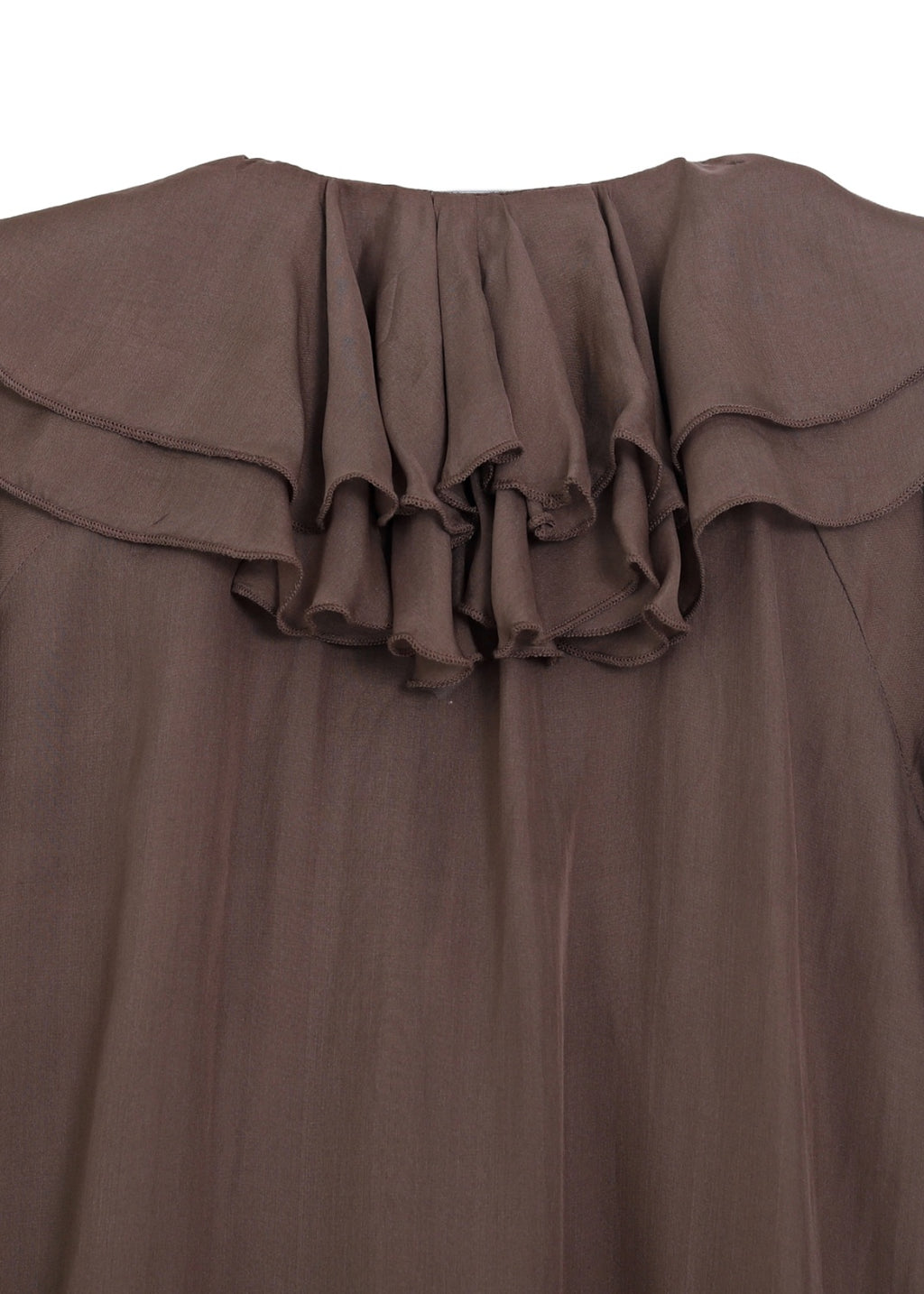 Blus med volanger i siden