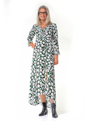 Mila Maxi Boho Dress in viscose crepe with high low hem line for sunny days is inspired from the 70’s, as the bell-shaped sleeves and the raw mini frills.